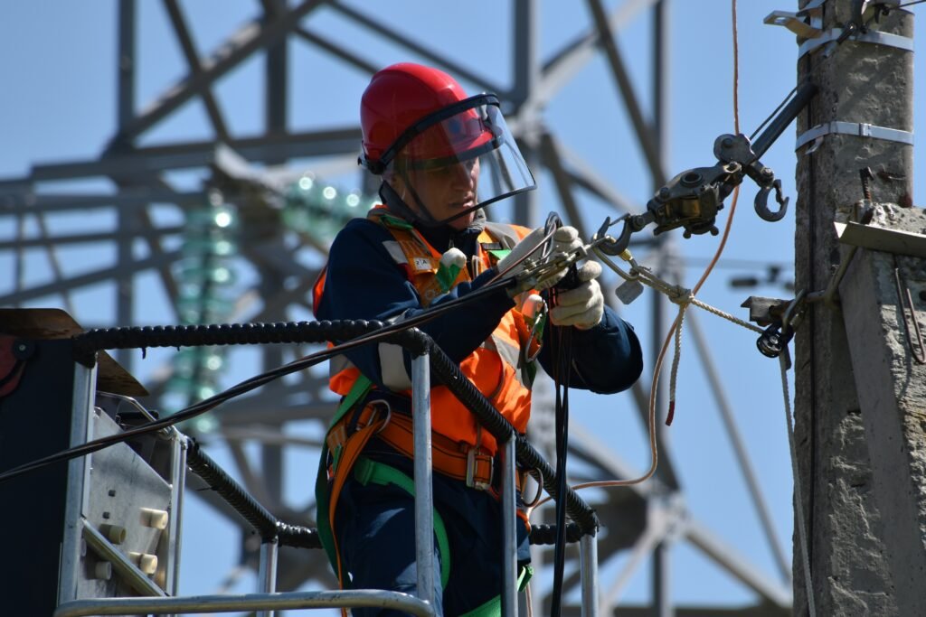 Employees completing workplace electrical safety training in a UK business environment